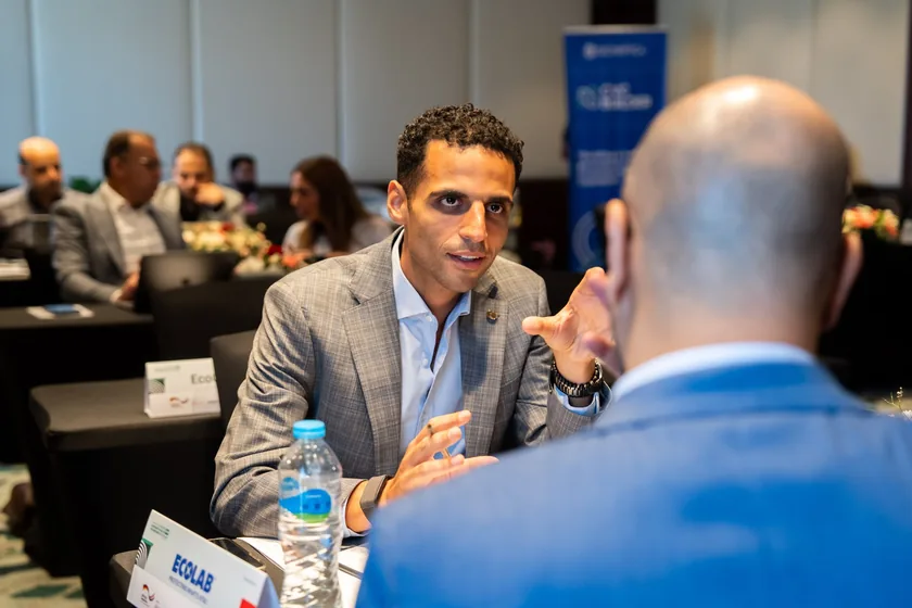 A corporate executive and a founder in a one-to-one meeting